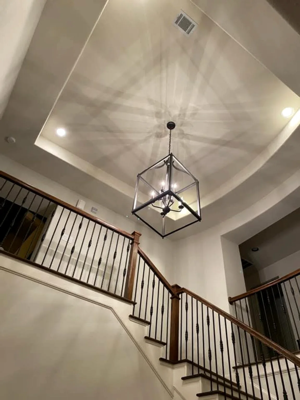 Finished high ceiling chandelier installation